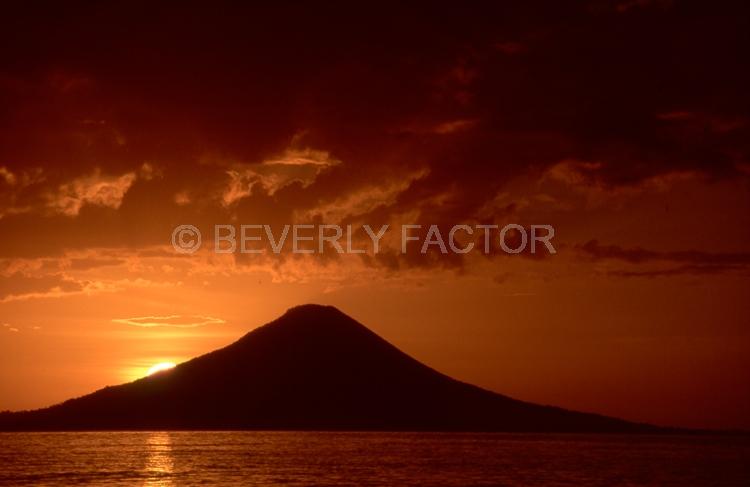 (Multiple values);sun;water;sillouettes;volcano;reflections;colorful;papua new guinea
